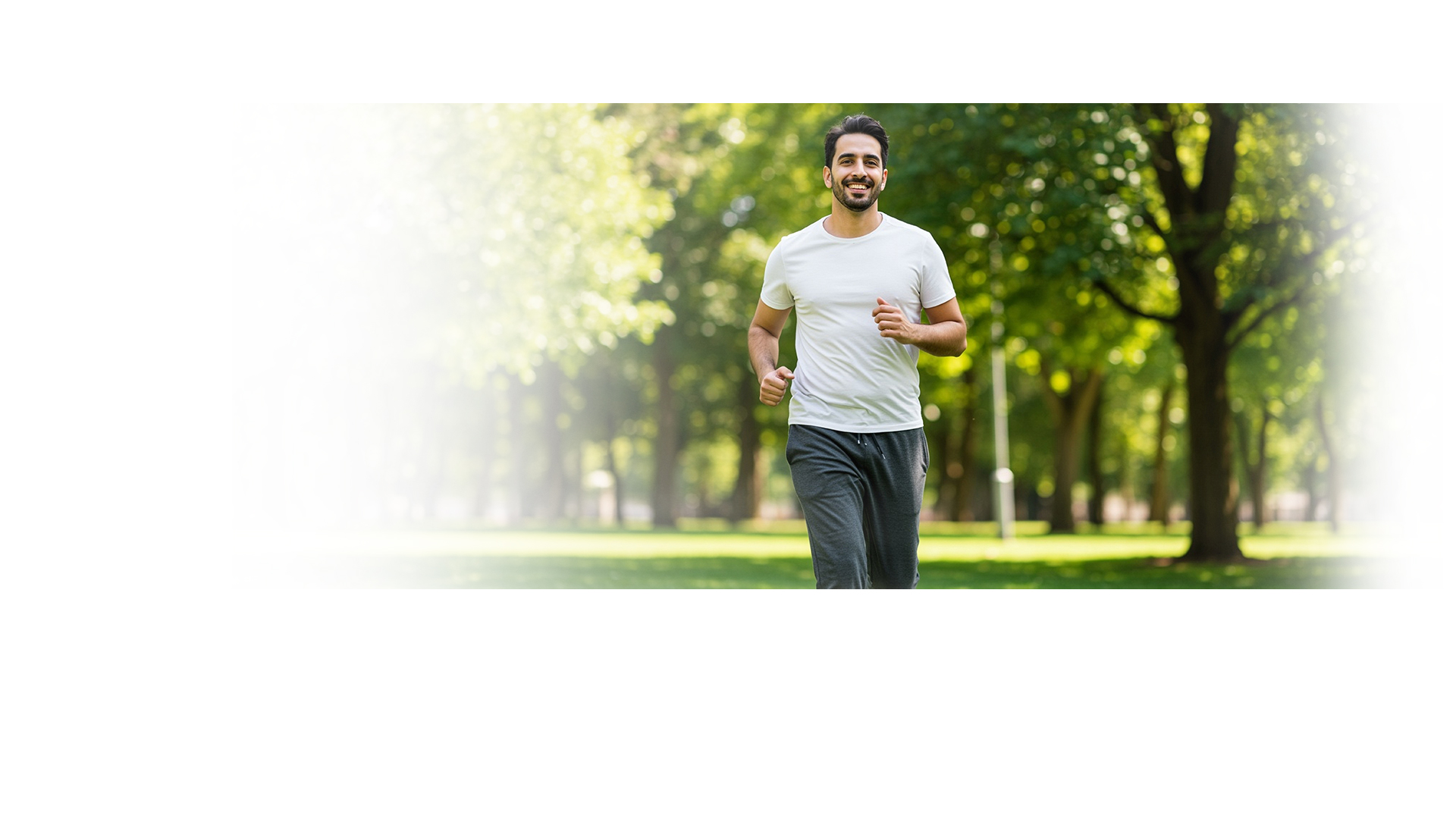 A healthy man jogging in a green park